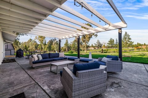 Relax and unwind in this stunning outdoor oasis! Spacious patio with modern seating, perfect for entertaining or soaking in serene views. Your backyard retreat awaits!