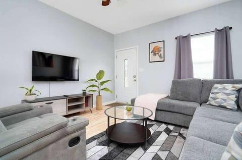 Living Room: The perfect spot to kick back: a comfy couch and a 50" smart TV await you!