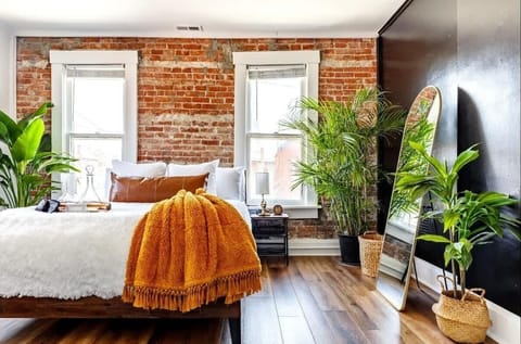 this plant-filled bedroom is a guest favorite for comfort & design recharge in style after exploring the city