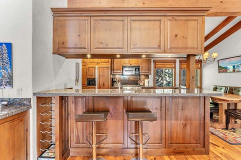 Kitchen: Drip coffee maker, toaster, Crockpot, cooking utensils, tableware