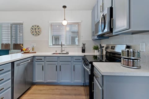 Bright, modern, and chef‑ready—A refined culinary space with quartz countertops, premium appliances, and timeless design—where everyday meals feel elevated.