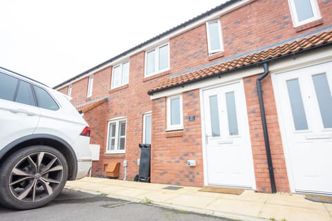 Front of the house. 1 parking space available.