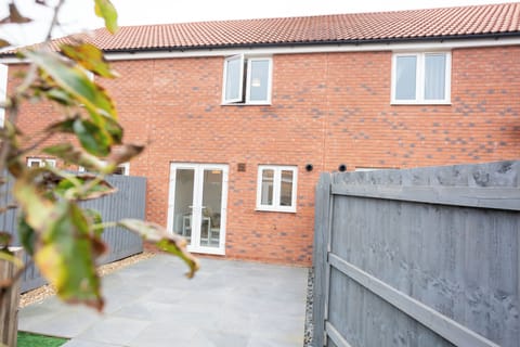 Back of the house patio. Accessed from the dining/kitchen area.