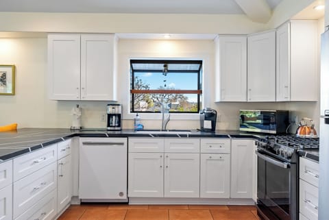 Open Kitchen with Stainless Steel Appliances.