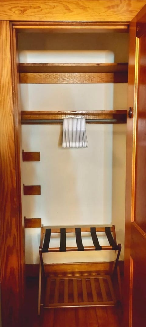 Each bedroom has a closet equipped with clothes hangers and luggage racks.