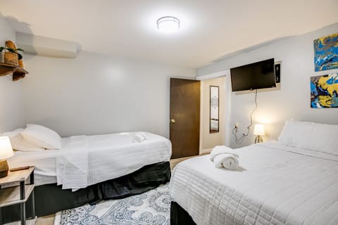 Basement twin room with TV.