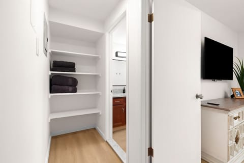 Fresh towels and extra storage are just steps from the bathroom for your convenience.