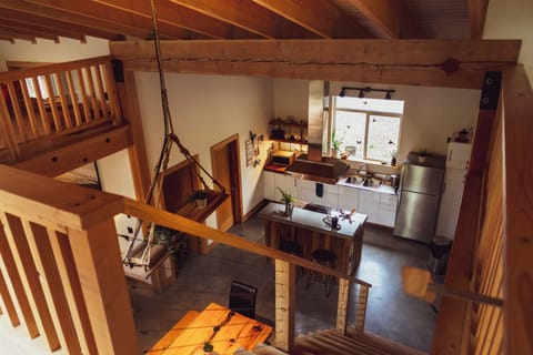 Open concept kitchen, dining, living, and loft space.