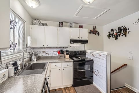 Enjoy a spacious and updated kitchen with modern appliances, perfect for preparing delicious meals during your stay.