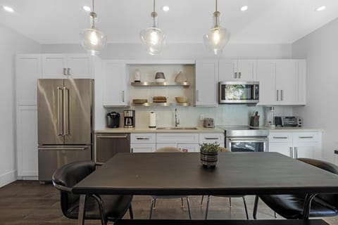 Open concept Kitchen and dining area with dining table and chairs for 6.