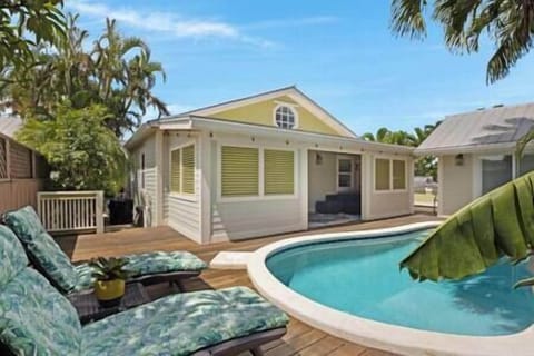 Back yard with pool and lounge area