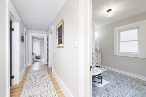 Bright and airy hallway with natural light, hardwood floors, and charming vintage details 🌿🚪 A welcoming path connecting the heart of the home to cozy, private rooms.
