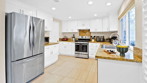 Kitchen goals: fresh appliances, clean design, and all the space you need. Book now! #travelsgvcertified