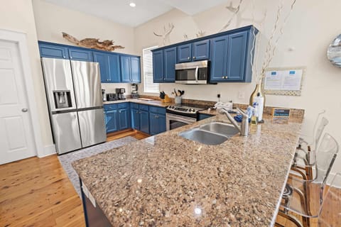 Kitchen: Keurig coffee maker, blender, toaster, toaster oven, cooking utensils, tableware