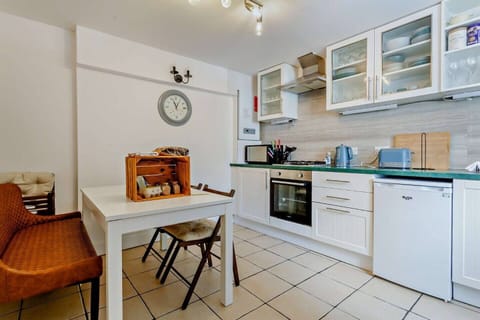 Fully equipped kitchen with dining area seating up to six