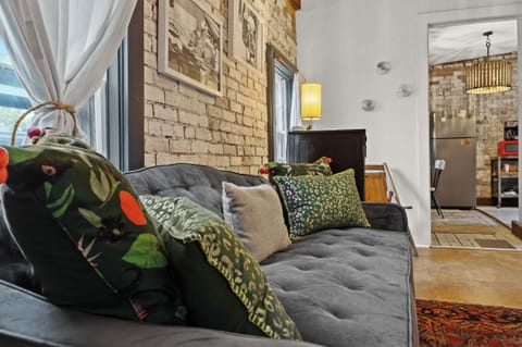 Living Room: Sink into relaxation on our plush sofa.