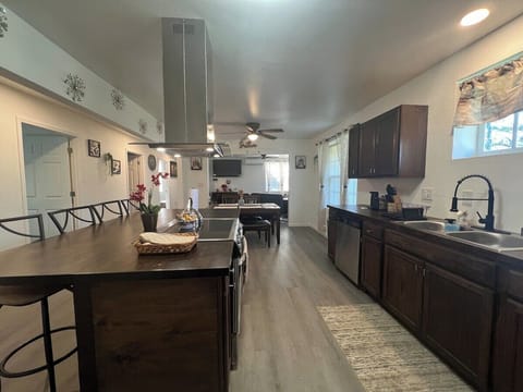 Center Island with fully equipped kitchen with air fryer microwave, Keurig and coffee maker,  waffle maker and basic condiments. 