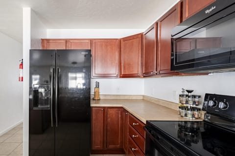 Stylish all-black appliances add a touch of sophistication.