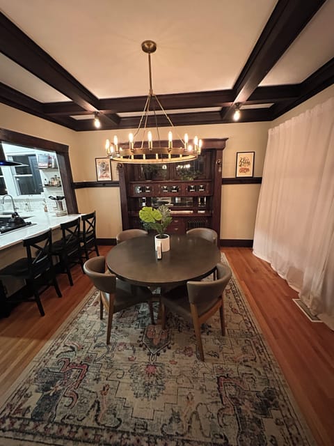 Bar seating for three people and dining table for four more.