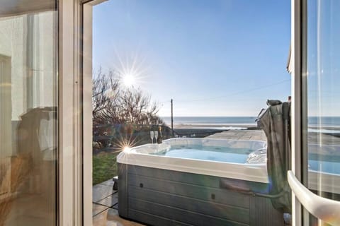 Swn y Don - Hot Tub Overlooking Newgale Beach Enjoy stunning sea views from the hot tub, the perfect spot to unwind after a day of exploring.