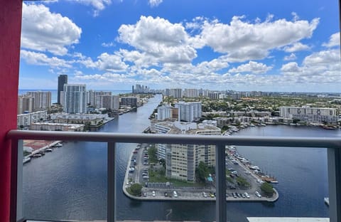 Private balcony with seating and partial ocean views — a great spot for morning coffee.