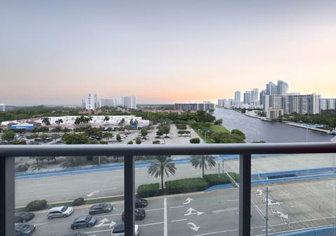 Private balcony with outdoor seating and skyline views.
