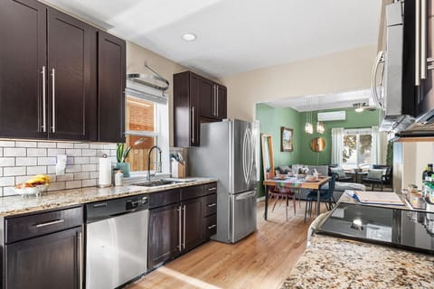 This remodeled kitchen has all stainless steel appliances and granite countertops