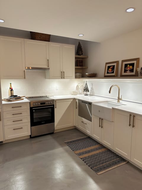 Very spacious Kitchen with fridge, stove, oven, dishwasher, and heated floors.