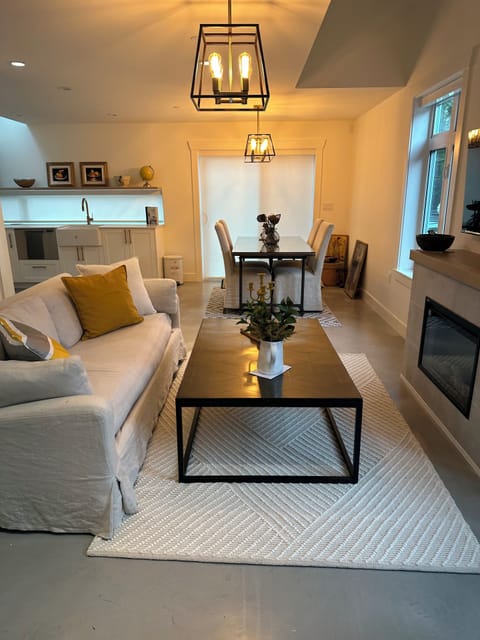 Living room and dining room, all dressed with the Restoration Hardware.