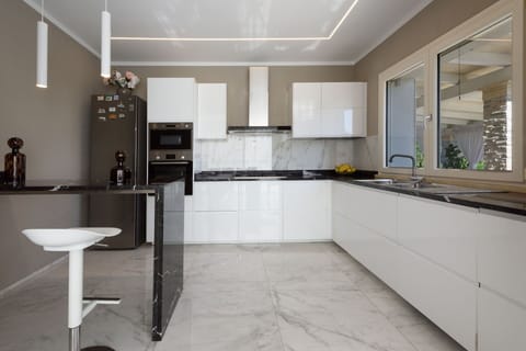 Furniture, Kitchen, Interior Design, Countertop, Flooring, Cabinetry, Wood, Floor, Kitchen Appliance, Home