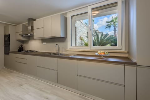 Kitchen, Countertop, Kitchen Appliance, Major Appliance, Flooring, Interior Design, Wood, Cabinetry, Home Appliance, Home