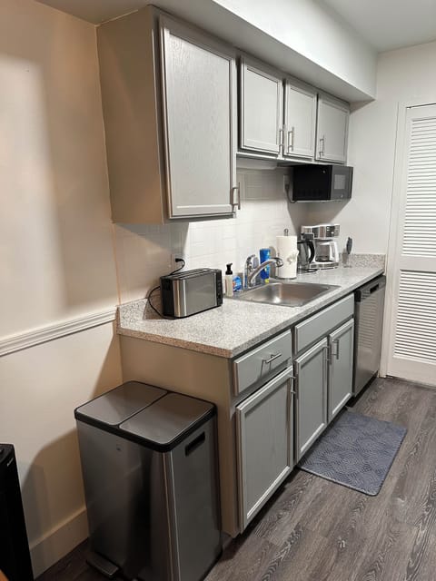 Kitchen with stainless steel appliances and newly updated cabinets.