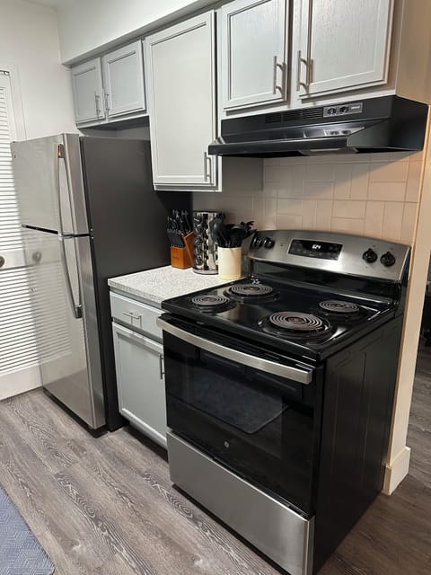 Kitchen with stainless steel appliances and newly updated cabinets.