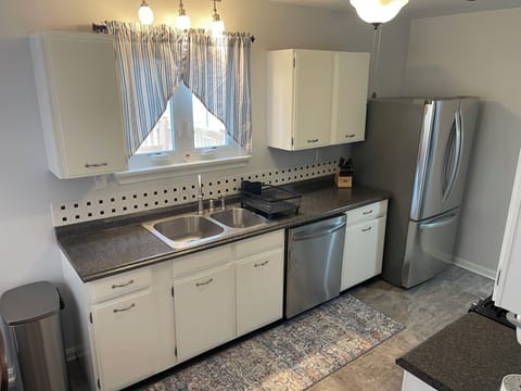 Kitchen with dishwasher and full size refrigerator