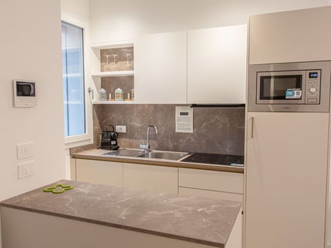 Kitchen, Countertop, Kitchen Appliance, Interior Design, Cabinetry, Flooring, Major Appliance, Furniture, Wood, Floor