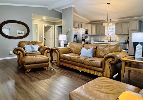 Welcome to the living room where the furniture practically begs you to relax.