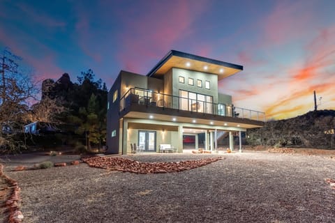 Secluded and private entrance (lower unit) with cozy front patio and dedicated covered parking.