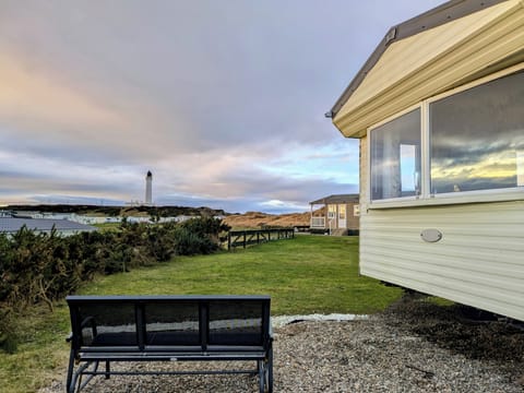 Stunning lighthouse and dune views from your peaceful caravan pitch.