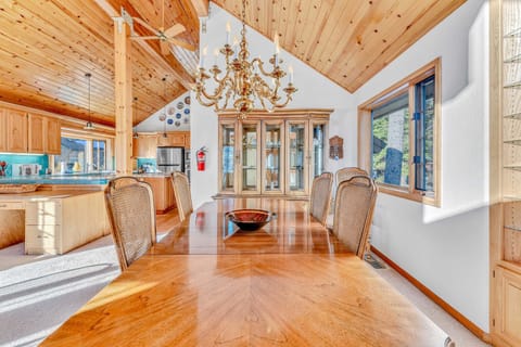 Dining room: L-shaped desk, multi-purpose table, wood-burning fireplace, main floor
