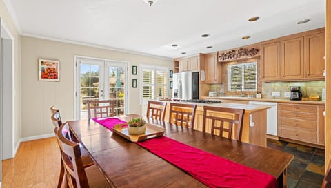 The dining area and kitchen offer beautiful views and a perfect spot for your next dinner gathering!