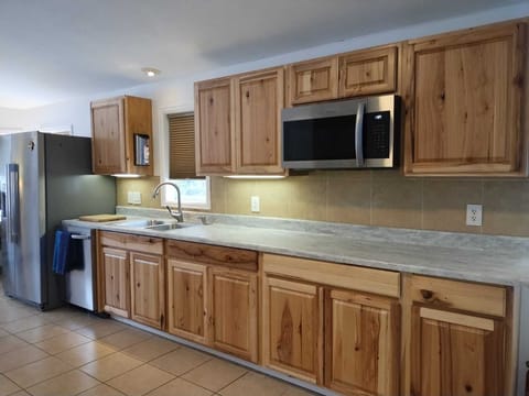 Full size Double Fridge/Freezer, dishwasher, microwave. NO STOVE OR BURNER.