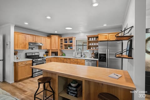 Seating for 2 at the bar! Plus games in the island shelves for you to enjoy!