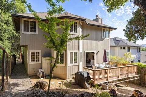 Outdoor seating, grill, and natural landscape