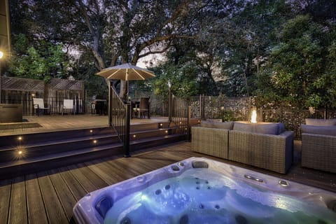 Wraparound deck with hot tub, fire pit, seating, grill, and amazing views