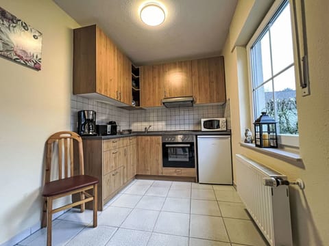 Furniture, Wood, Kitchen, Flooring, Interior Design, Cabinetry, Floor, Countertop, Major Appliance, Ceiling