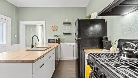 Sleek black appliances in a fully equipped kitchen.
