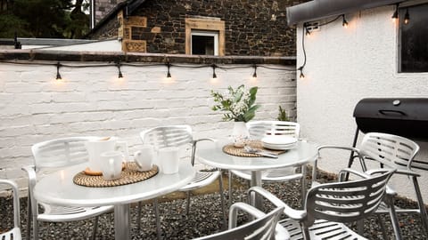 Dalgety - garden seating in the courtyard to the rear of the house