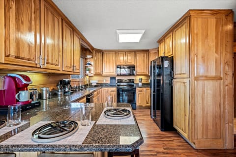 Start your day with a fresh brew and a mountain view from this charming kitchen nook.