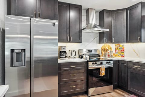 Kitchen: Fully equipped with drip coffee maker, Crockpot, French press, and Samsung appliances, main floor
