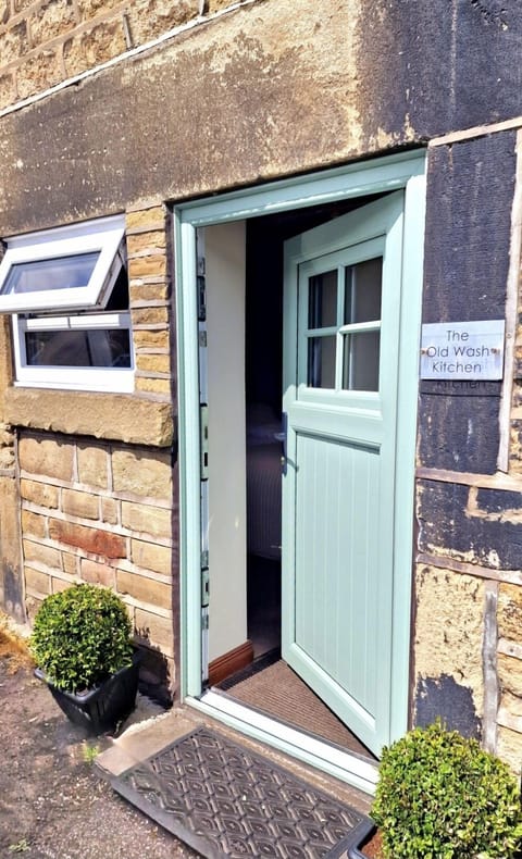 Entrance from the riverside lane